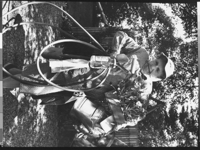 Ardent Gardener Adele Du Breuil Ladened With Gardening Equipment by Alfred Eisenstaedt Pricing Limited Edition Print image