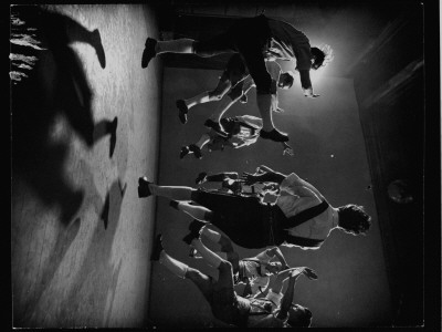 Group Demonstrating Leaping Step Of An Austrian Folk Dance by Gjon Mili Pricing Limited Edition Print image