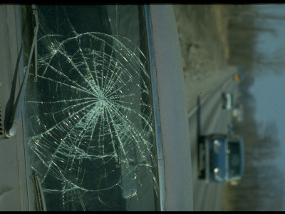 Car Windshield Cracked In Web-Like Pattern After Accident by Ralph Crane Pricing Limited Edition Print image