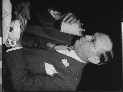 Writer Damon Runyon At Restaurant Table Drinking Milk by Gjon Mili Pricing Limited Edition Print image