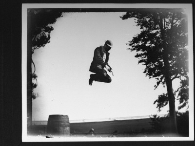 Edgar J. Taylor Caught In Mid-Air Jumping Off A Barrel by Wallace G. Levison Pricing Limited Edition Print image