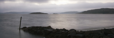 A Landing Made Of Rocks In A Lake by Mattias Nilsson Pricing Limited Edition Print image