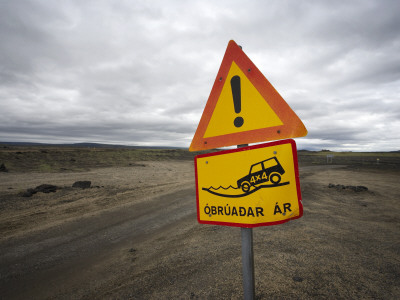 A Warning Sign Before A River With No Bridge In The Wilderness Of Iceland by Atli Mar Pricing Limited Edition Print image
