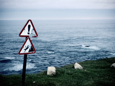 Warning Signs By The Edge Of A High Cliff, Latrabjorg, Iceland by Atli Mar Pricing Limited Edition Print image