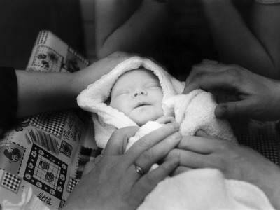 A Newborn Baby Wrapped In A Towel by Bragi Thor Josefson Pricing Limited Edition Print image