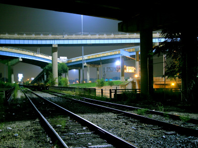 Train Tracks Under Freeway Interchange by Geoffrey George Pricing Limited Edition Print image