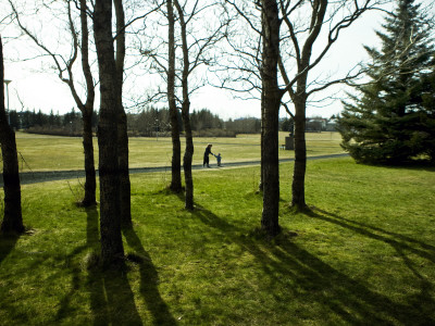 Mother And Her Son In A Park ( Miklatun ) In Reykjavik, Iceland by Gusk Pricing Limited Edition Print image