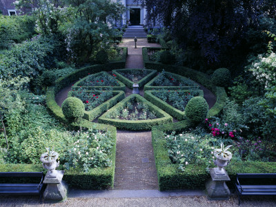 Amsterdam - Private Garden - View Onto Formal Garden With Clipped Box, Urns And Sundial by Clive Nichols Pricing Limited Edition Print image