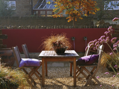 Autumnal Contemporary Courtyard With Table And Chairs, Containers With Carex by Clive Nichols Pricing Limited Edition Print image