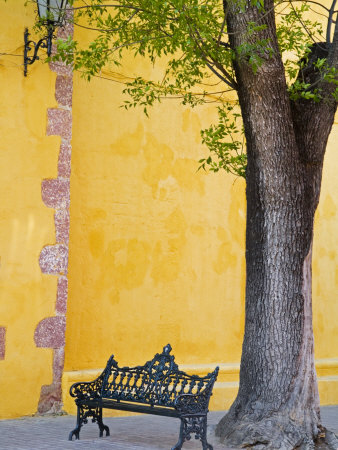 An Iron Bench On A Sidewalk, San Miguel, Guanajuato State, Mexico by Julie Eggers Pricing Limited Edition Print image
