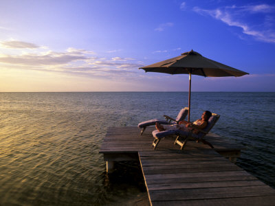 Relaxing At Sunset, Ambergris Caye, Belize by Michael Defreitas Pricing Limited Edition Print image