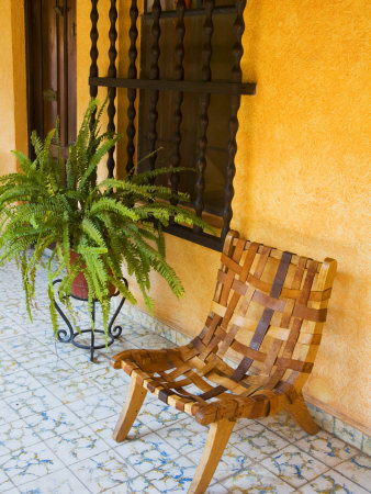 Leather Chair In Courtyard, San Miguel De Allende, Guanajuato State, Mexico by Julie Eggers Pricing Limited Edition Print image