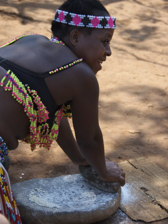 Young Girl Grinding Corn, Shakaland, Kwazulu Natal, South Africa by Lisa S. Engelbrecht Pricing Limited Edition Print image