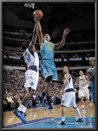 New Orleans Hornets V Dallas Mavericks: Jerryd Bayless And Dominique Jones by Glenn James Pricing Limited Edition Print image