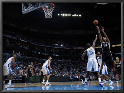 San Antonio Spurs V New Orleans Hornets: Tim Duncan And Emeka Okafor by Layne Murdoch Pricing Limited Edition Print image