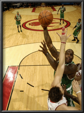 Boston Celtics V Toronto Raptors: Shaquille O'neal And Andrea Bargnani by Ron Turenne Pricing Limited Edition Print image