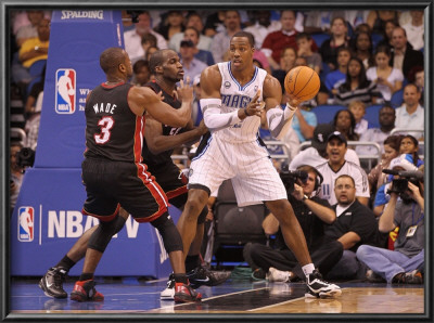 Miami Heat V Orlando Magic: Dwight Howard And Dwyane Wade by Mike Ehrmann Pricing Limited Edition Print image