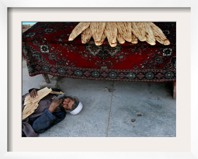 A Beggar Sleeps Next To A Bakery In Kabul, Afghanistan, Wednesday, June 7, 2006 by Rodrigo Abd Pricing Limited Edition Print image
