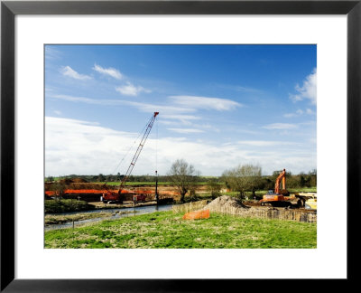 Crane Lifitng Steel Piling Beside River Avon During Construction Of The Barford Bypass, England by Martin Page Pricing Limited Edition Print image