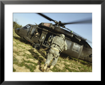 Us Army Soldiers Board A Uh-60 Black Hawk Helicopter by Stocktrek Images Pricing Limited Edition Print image