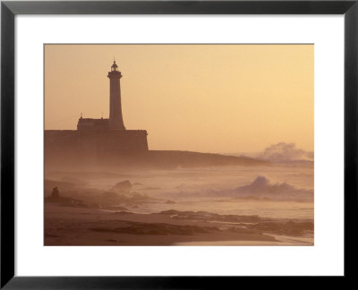 Lighthouse At Sunset With Crashing Waves, Morocco by John & Lisa Merrill Pricing Limited Edition Print image