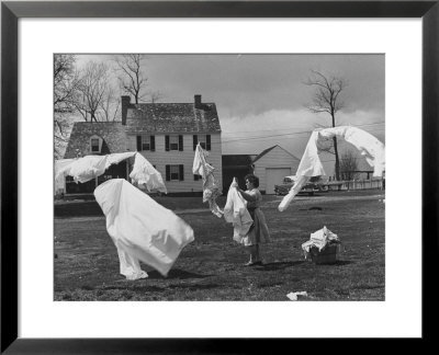 Woman Hanging Up The Laundry On The Line by Ed Clark Pricing Limited Edition Print image