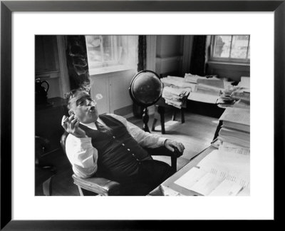 Mayor Fiorello Laguardia Blowing Smoke Rings Sitting At Desk In His Office by William C. Shrout Pricing Limited Edition Print image