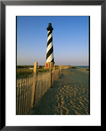 Cape Hatteras Lighthouse With Surrounding Sand Fence by Steve Winter Pricing Limited Edition Print image
