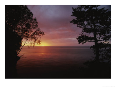 A Sunset Over Lake Superior In The Apostle Islands by Raymond Gehman Pricing Limited Edition Print image