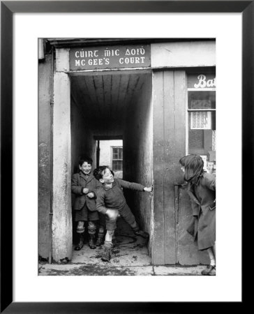Children Playing At The Entrance To Mcgee's Court Slum On Camden Street by Tony Linck Pricing Limited Edition Print image