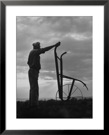 Farmer Plowing The Fields by Ed Clark Pricing Limited Edition Print image