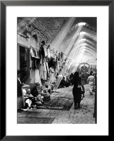 Sunlight Streaming Down From Holes In Roof On Vendors In Covered Bazaar by Alfred Eisenstaedt Pricing Limited Edition Print image