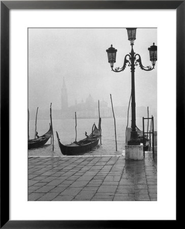 Moored Gondolas On A Foggy Grand Canal With Santa Maria Della Salute Church In The Background by Dmitri Kessel Pricing Limited Edition Print image