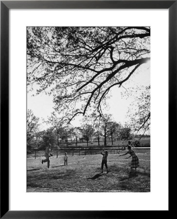 Springtime In Clarksville On A Farm With A Family Playing Baseball In The Yard by Yale Joel Pricing Limited Edition Print image