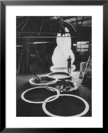 Preparations For The Olympics, Olympic Symbol Being Made In Neon by John Dominis Pricing Limited Edition Print image