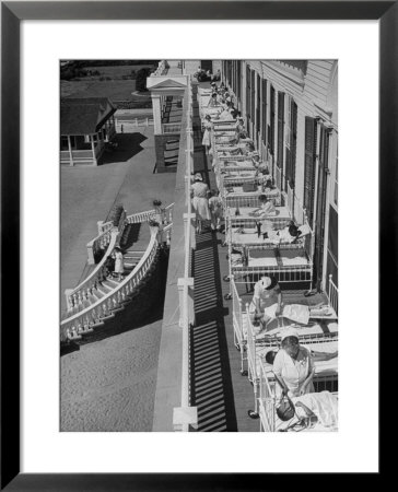 Nurses Tending To Afflicted Children As They Lie On A Sundeck In Sanitarium In Resort by Alfred Eisenstaedt Pricing Limited Edition Print image