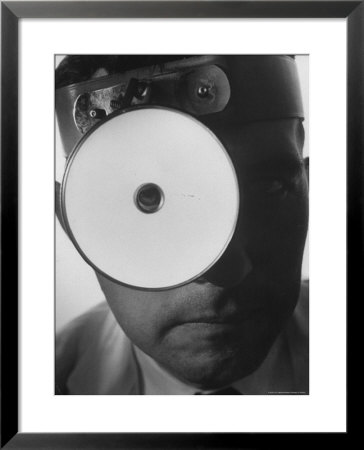 Closeup Of A Doctor Wearing A Mask Of His Profession by Andreas Feininger Pricing Limited Edition Print image