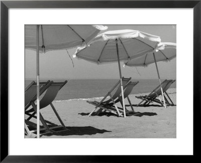 Sun Umbrellas And Lawn Chairs On A Beach by Vincenzo Balocchi Pricing Limited Edition Print image