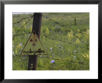 Sign On Barbed-Wire Fence Of Radioactive Waste Dump In Use Within City Limits by Christopher Herwig Pricing Limited Edition Print image