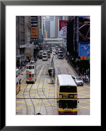 Trams, Des Voeux Road, Central, Hong Kong Island, Hong Kong, China by Amanda Hall Pricing Limited Edition Print image