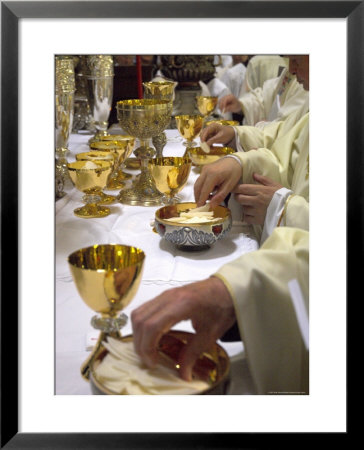 Priests' Hands Taking The Host During Mass In Easter Week by Eitan Simanor Pricing Limited Edition Print image