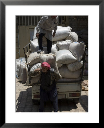 Men Loading Grain, Aleppo (Haleb), Syria, Middle East by Christian Kober Pricing Limited Edition Print image