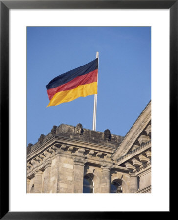 The German Flag Flies High Above The New Reichstag In Berlin, Germany by Jason Edwards Pricing Limited Edition Print image