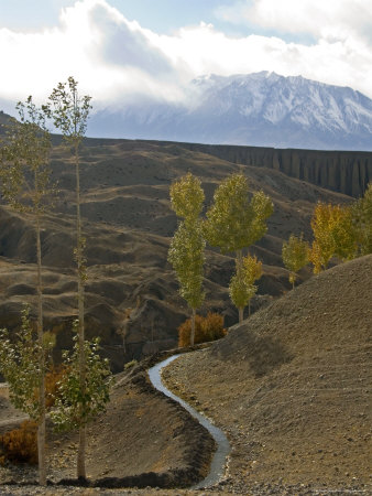 Winding Irrigation Ditch On A Hillside In Mustang, Nepal by Stephen Sharnoff Pricing Limited Edition Print image