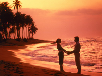 Silhouetted Couple Standing On A Tropical Beach by Wallace Garrison Pricing Limited Edition Print image
