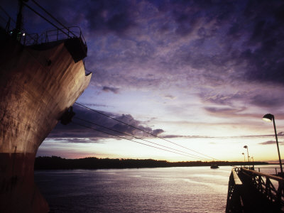 Cargo Ship Docked At Sunset by Stewart Cohen Pricing Limited Edition Print image