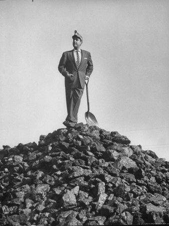 Country Western Singer Tennessee Ernie Ford In Business Suit And Miner's Helmet Leaning On A Shovel by Allan Grant Pricing Limited Edition Print image