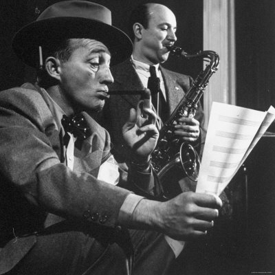 Bing Crosby, Holding A Pipe In His Mouth And Sheet Music In His Hand by Gjon Mili Pricing Limited Edition Print image