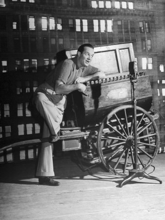 Bob Hope Taking Part In A Radio Show For Servicemen Overseas With A Unique Musical Instrument by John Florea Pricing Limited Edition Print image