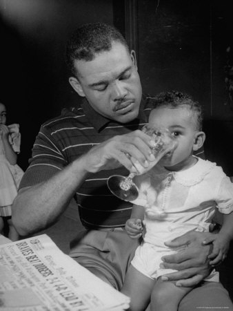 Joe Louis Sitting In With Young Son by Joe Scherschel Pricing Limited Edition Print image